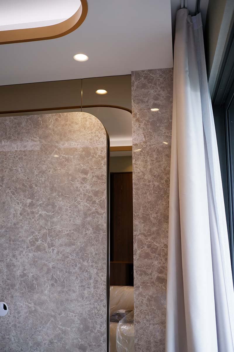 Curtain tracks concealed inside a ceiling pelmet