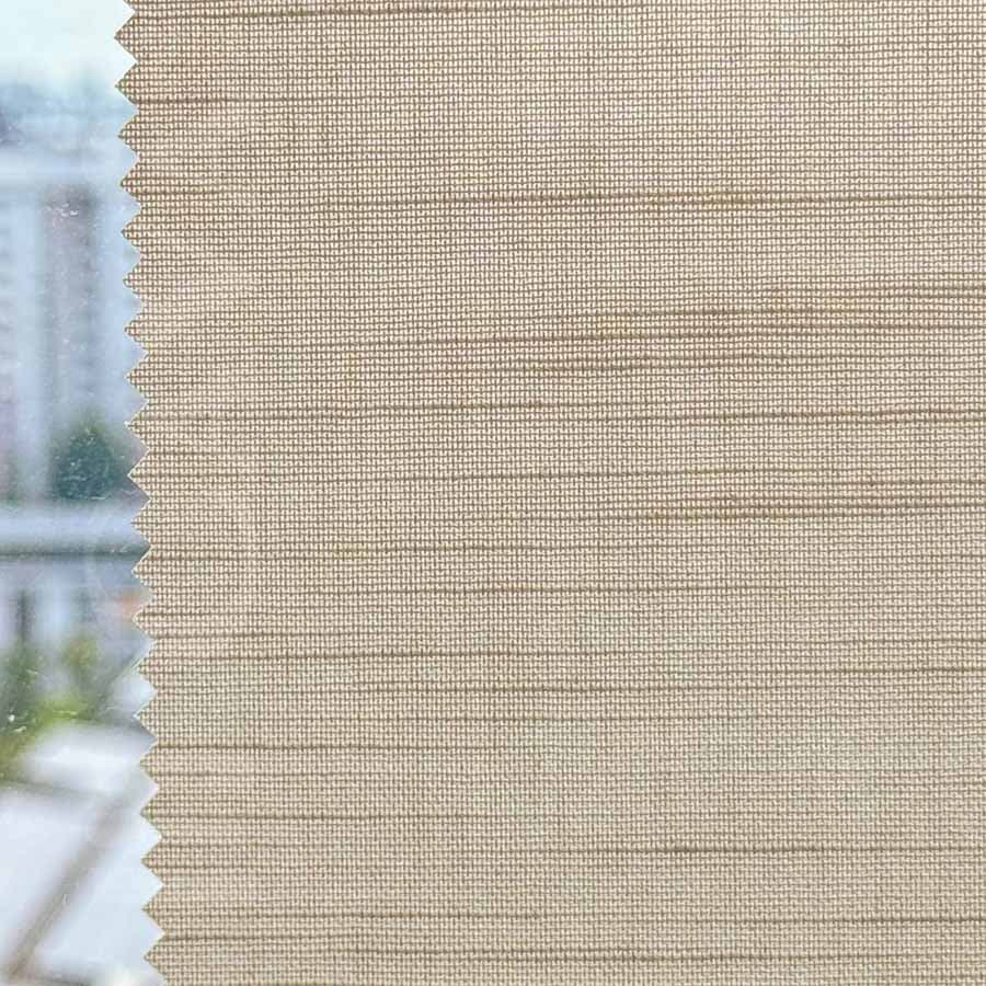 Light-filtering roller blind fitted to a bright window